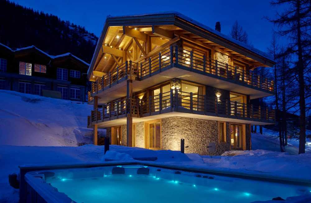 Resort with antique wooden structure and stone cladding