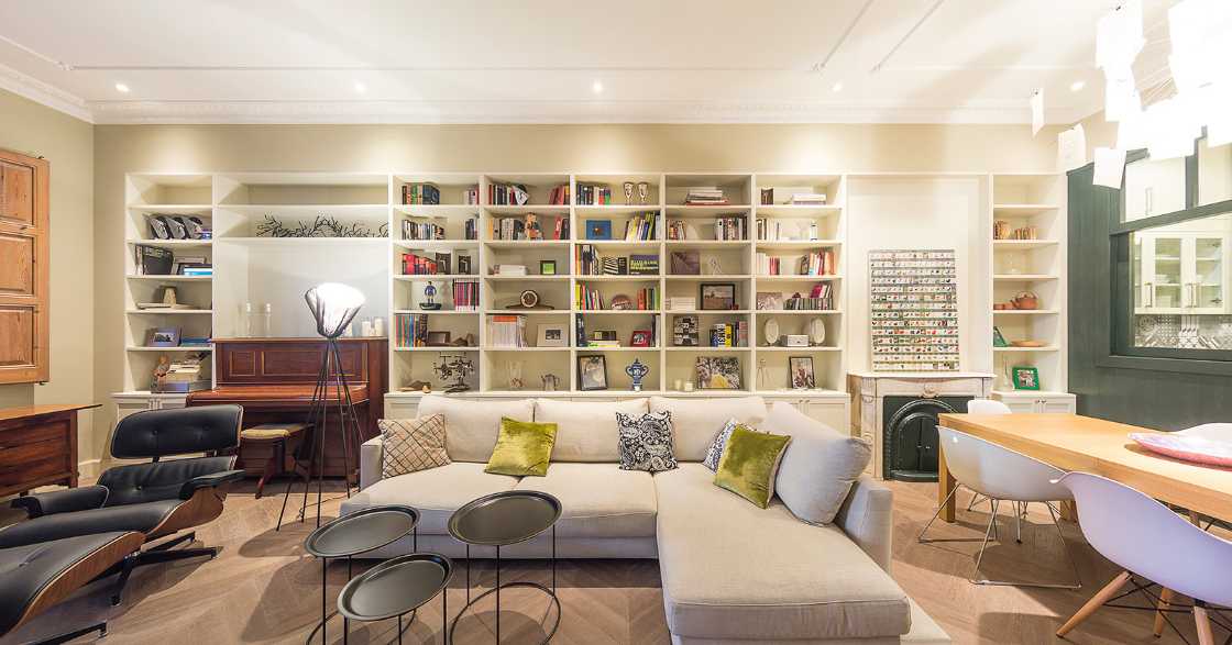 living room with bookcase wall