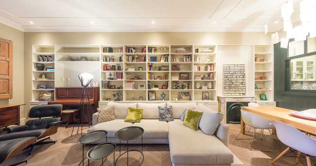 living room with bookcase wall