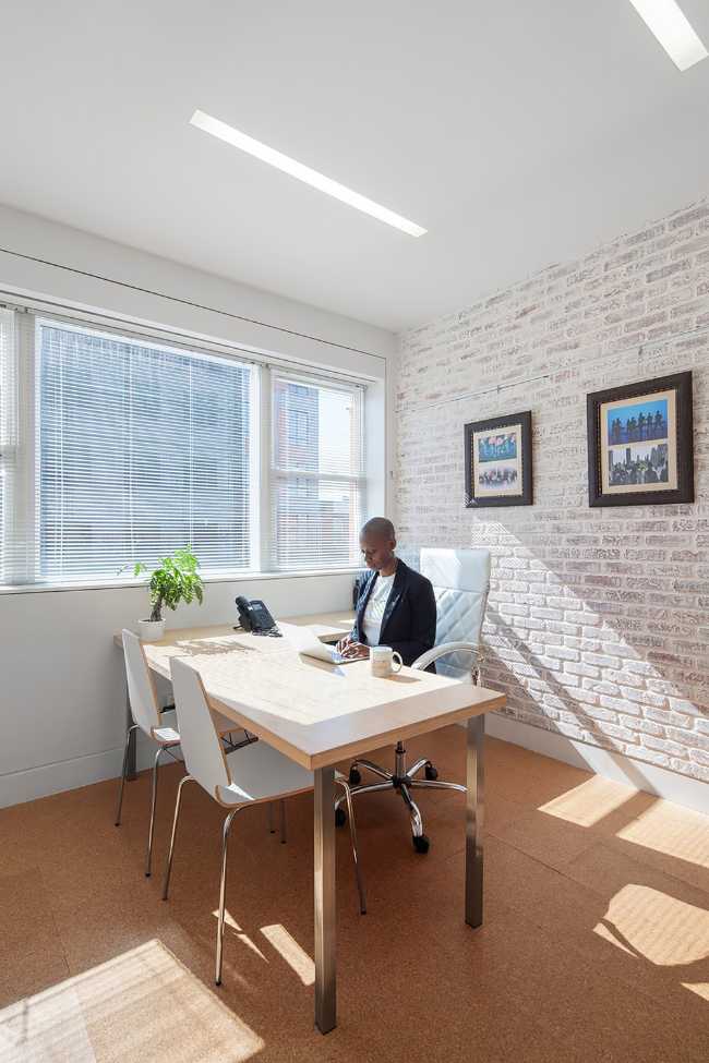 Dance school office with white brick wall