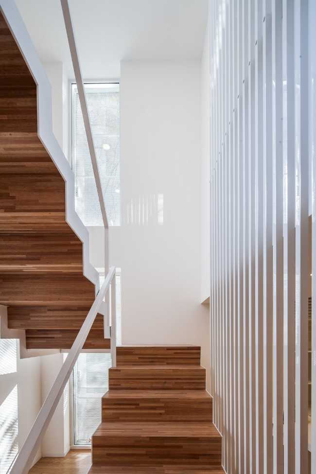 internal staircase in wood and white balustrade