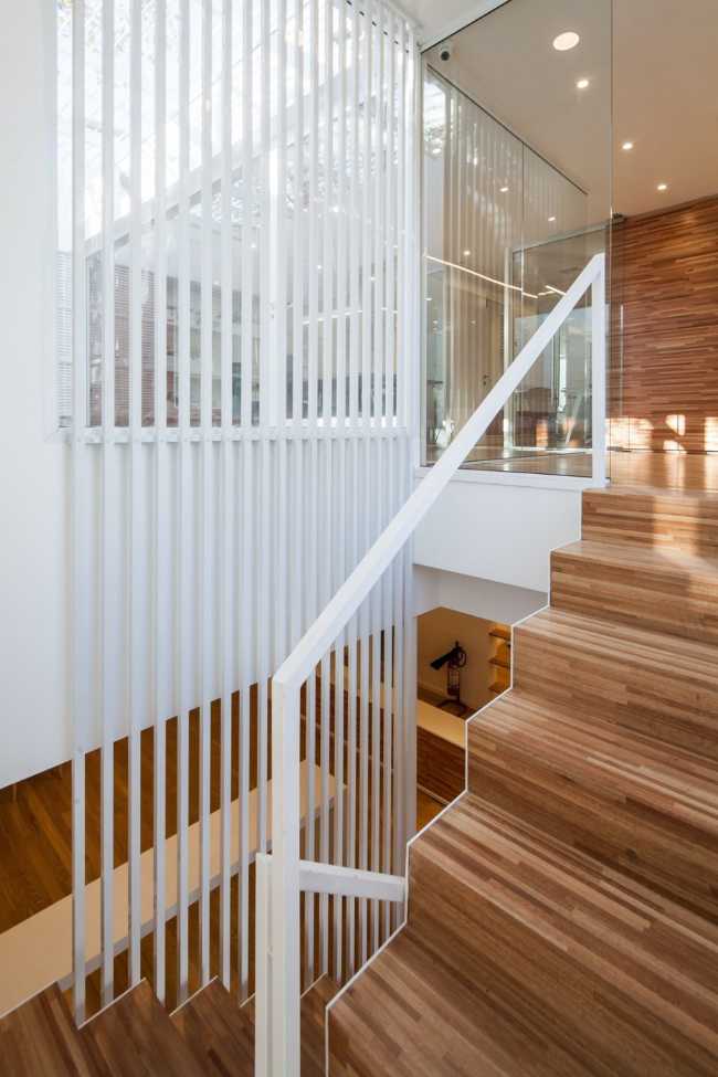 wooden staircase and white balustrade