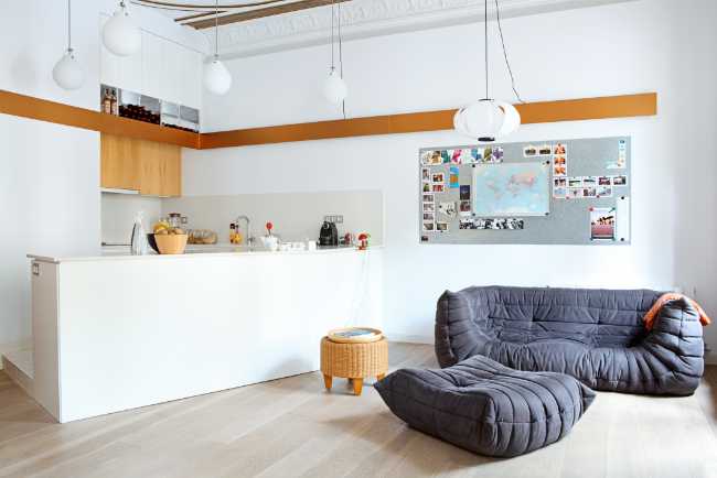 Kitchen and living spaces white and black sofa