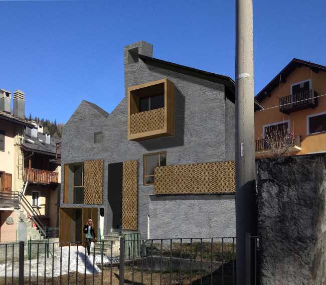Ristrutturazione residenziale di due edifici con copertura unica