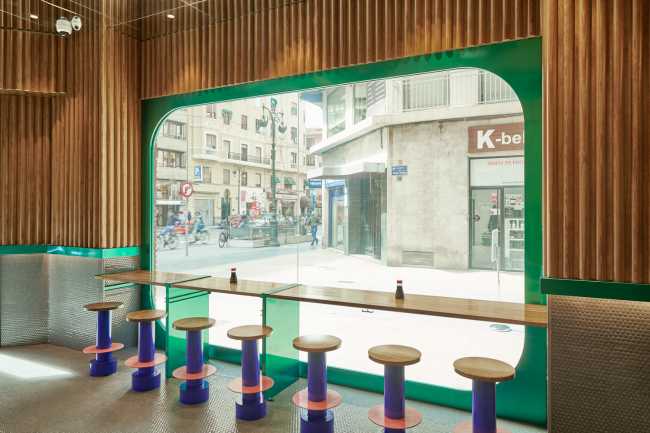 window on street green frame wooden counter