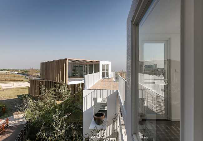 stacked off-center white and wooden containers