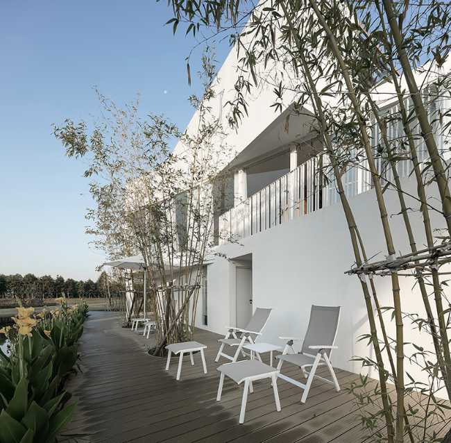 stacked containers for shopping mall terrace wooden floor