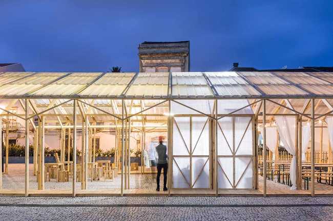 Temporary wooden pavilion and night lighting