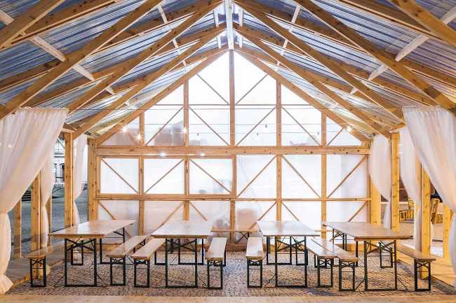 Wooden pavilion in the shape of a house