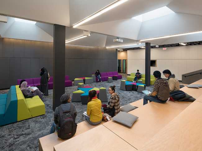 Wooden seats and coloured sofas