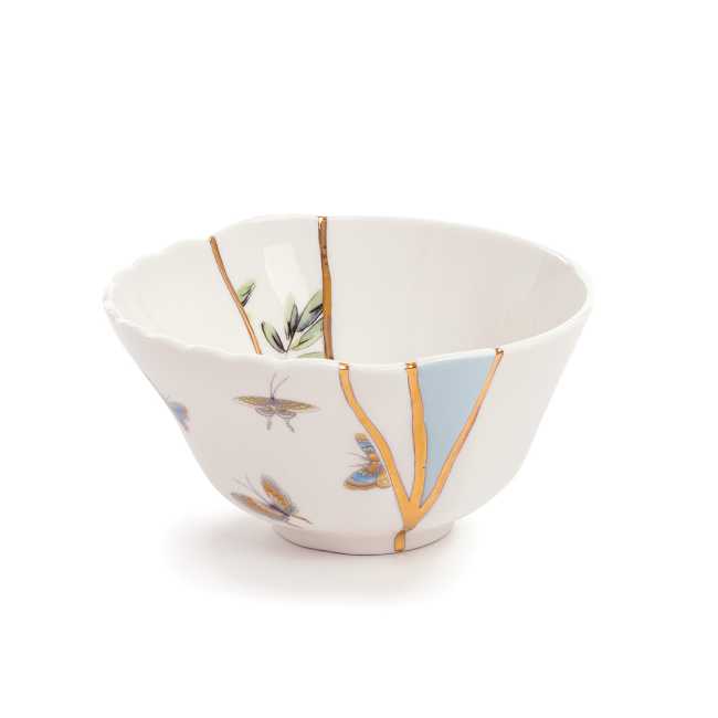 Kintsugi cup decorated with gold inserts