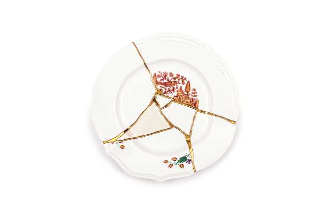 Kintsugi plate decorated with gold inserts
