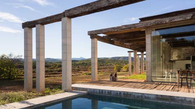 outdoor pool veranda concrete pillars wooden beams