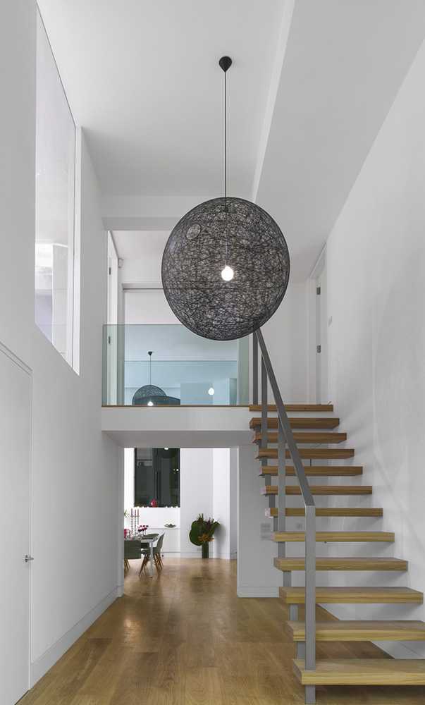 Apartment in loft style wooden and metal staircase