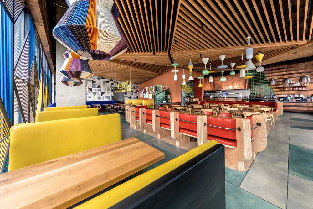 Restaurant with colorful and wooden interior