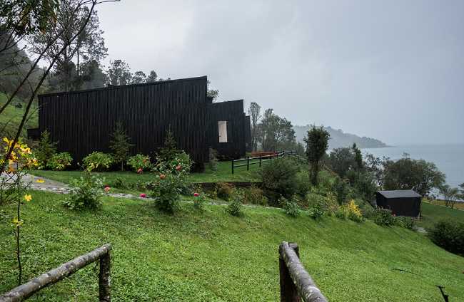 Wooden house and green lawn