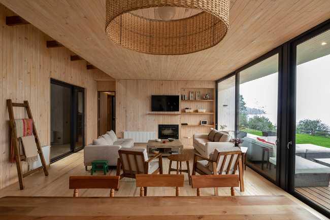 Wooden living room with panorama window