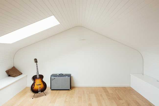 White attic with wooden floor
