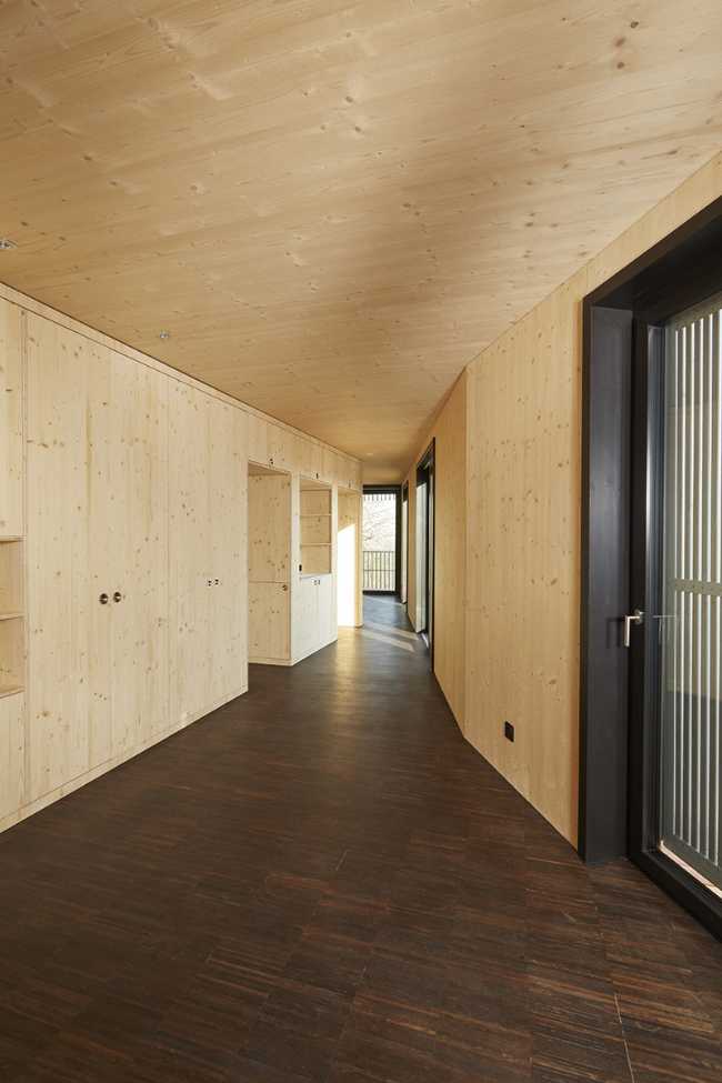 Interni complesso residenziale in legno