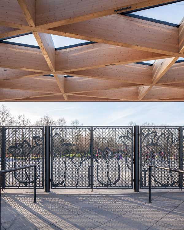 Triangular mesh wooden roof and metal gate