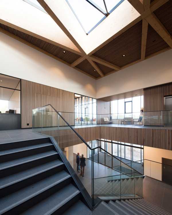 Interior wooden staircase and glass balustrade
