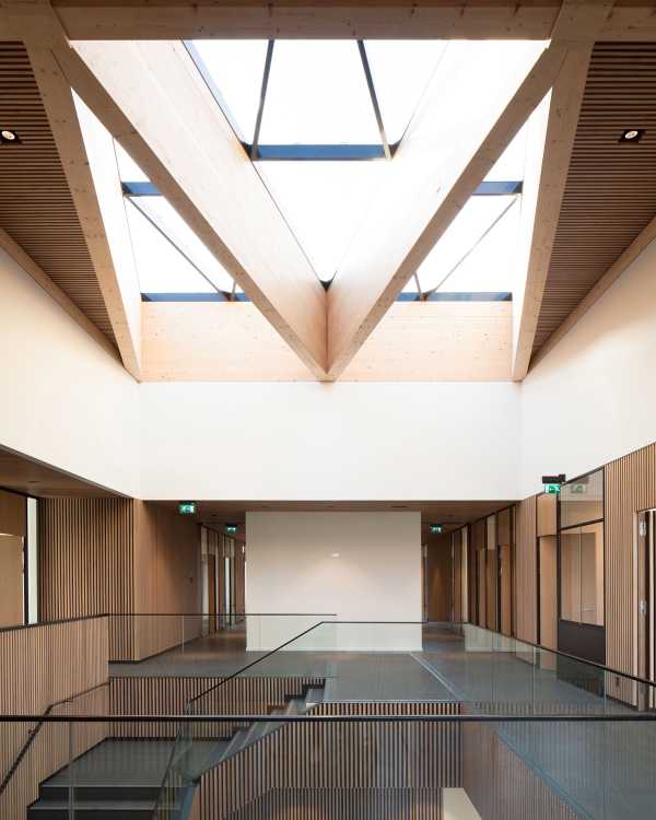 Interior wooden staircase and glass balustrade