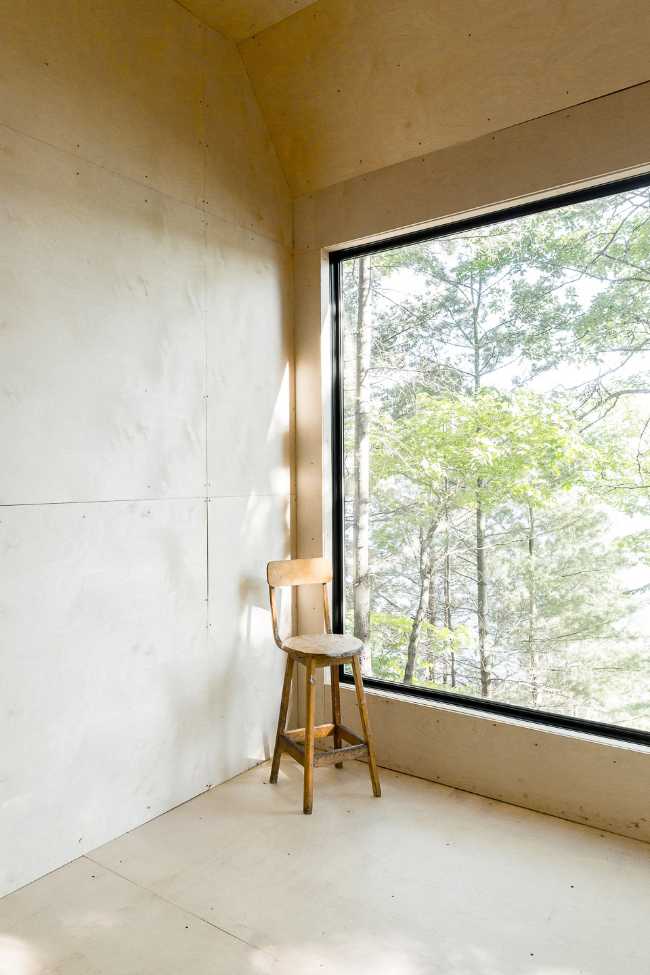 Square window with view of trees