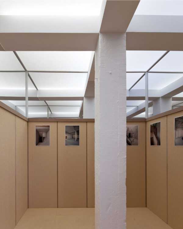 Concrete column in the middle of a wooden installation