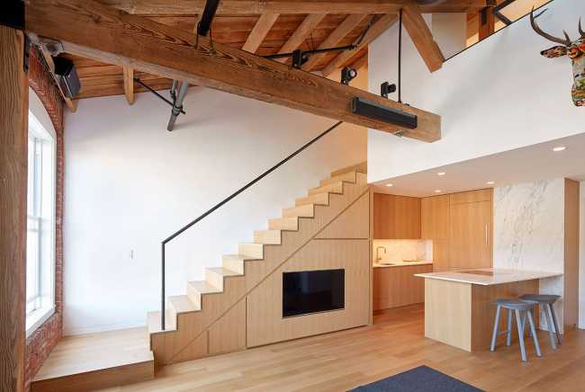 Internal wooden staircase double height space