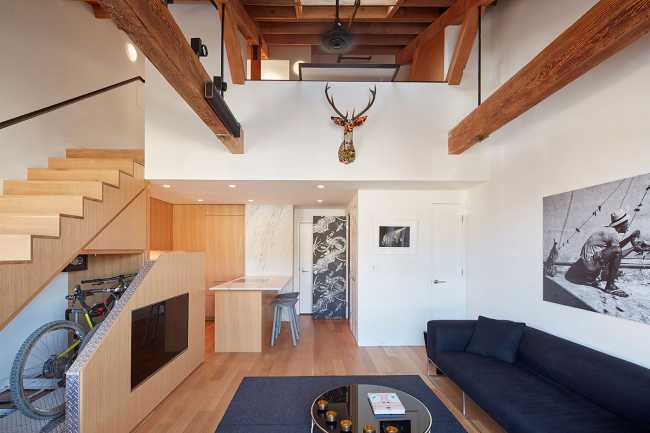 Modern loft made of brick and wood. Small touches improve living comfort