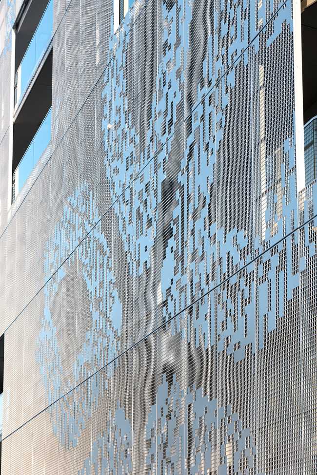 Residential complex with perforated sheet facade
