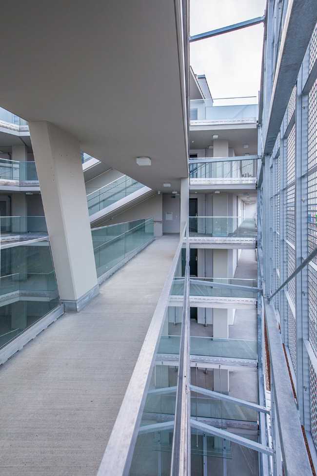 Residential complex facade perforated sheet metal for connections to corridors and stairs