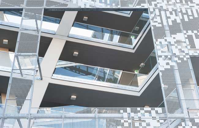 Residential complex facade perforated sheet vertical connections courtyard
