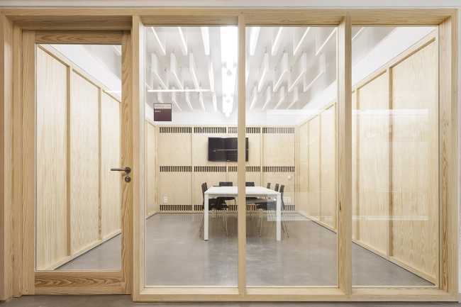 Meeting room with glass window and wooden fixtures