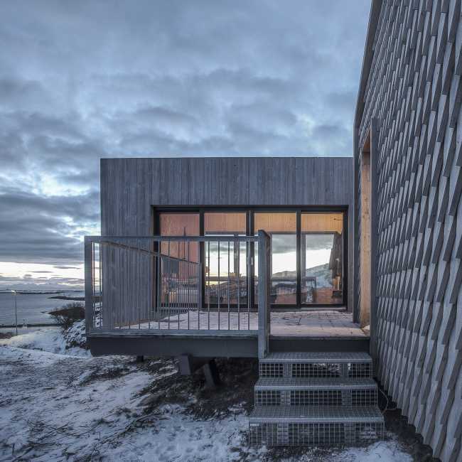 wooden housing module structure type palafitte glazed entrance