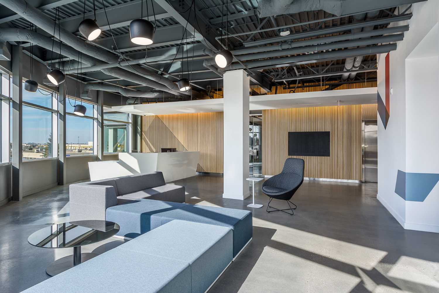 waiting room offices with wood upholstery and continuous upholstered seats