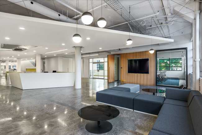 offices reception linear false ceiling upholstered seating