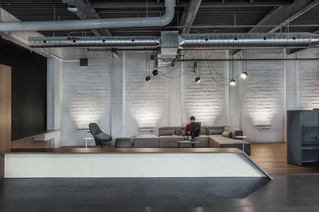 offices waiting room brick wall