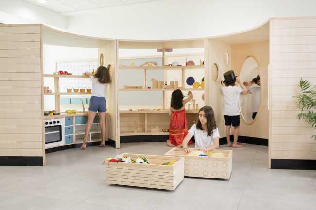 inclusive school play areas and wooden bookcase