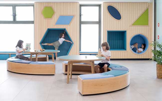 inclusive school study spaces library wooden tables and seats