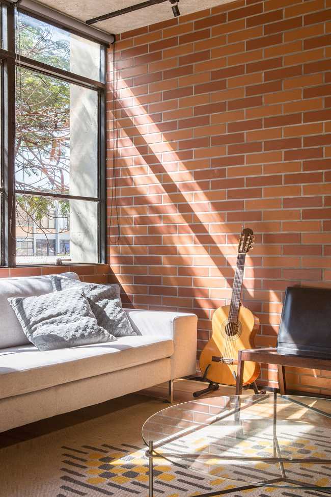 Large window with sofa and guitar