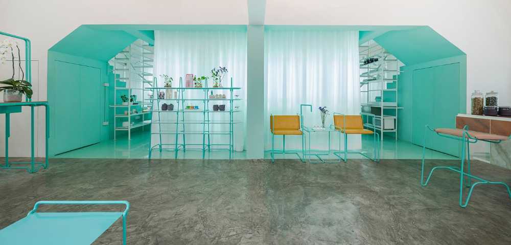 Spa inside a Shophouse in Bangkok. Colours, light and fabrics for the double volume