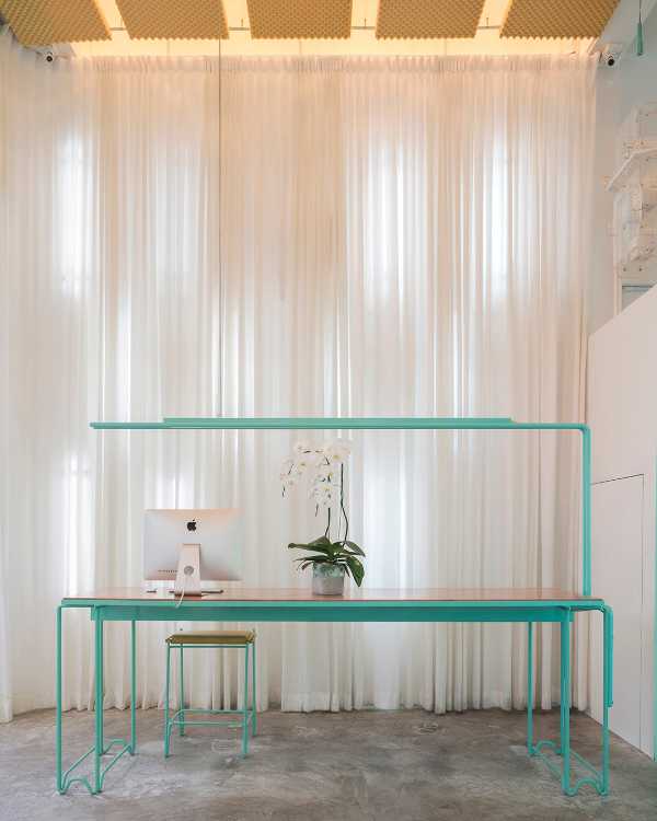 Spa inside a Shophouse in Bangkok. Colours, light and fabrics for the double volume