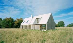 Wooden house with traditional shapes