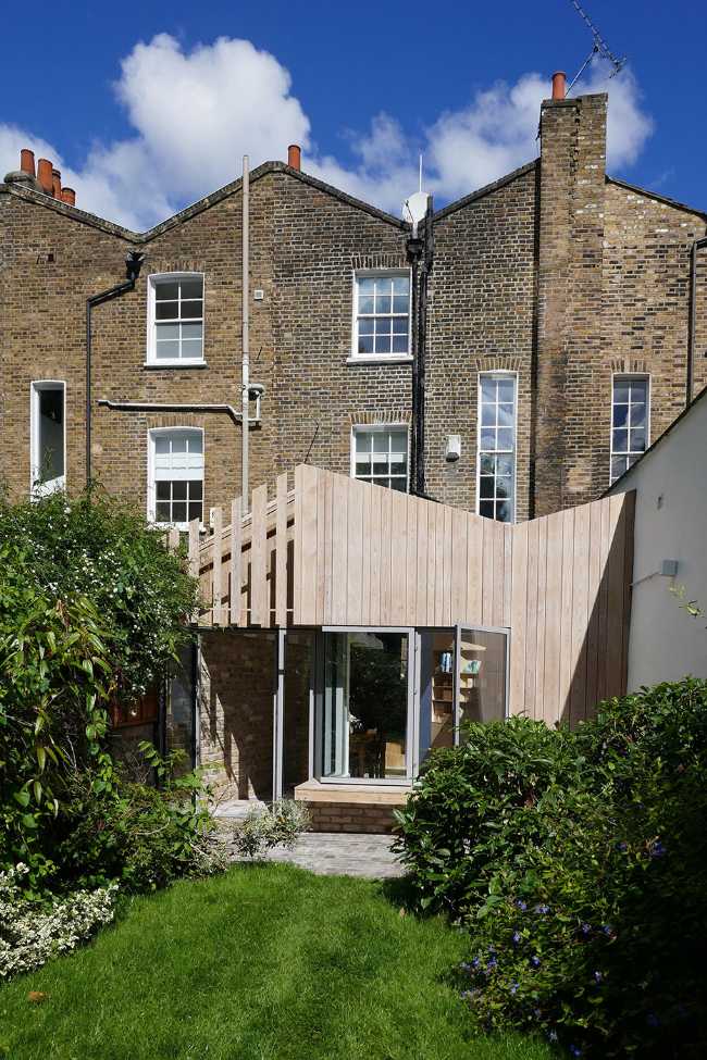 Ampliamento in legno abitazione in mattoni