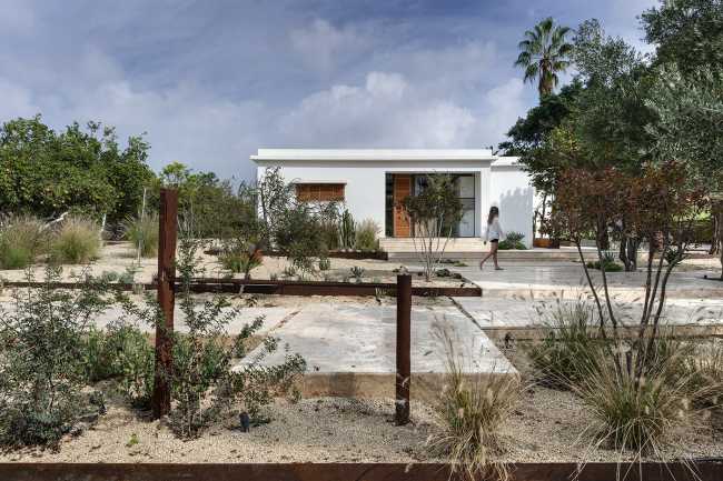 Mediterranean house surrounded by cactus