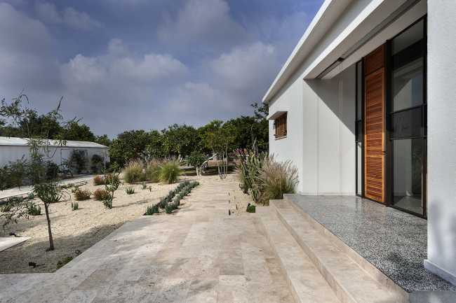 Mediterranean house surrounded by cactus