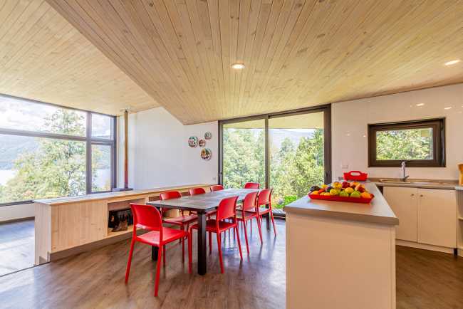 Wooden interiors with red chairs