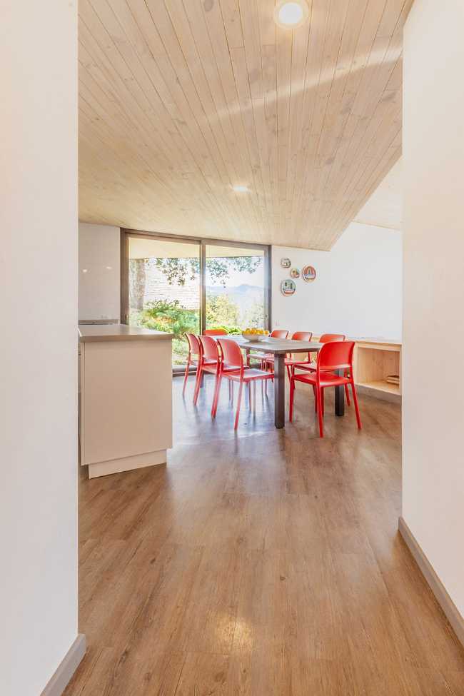 Wooden interiors with red chairs