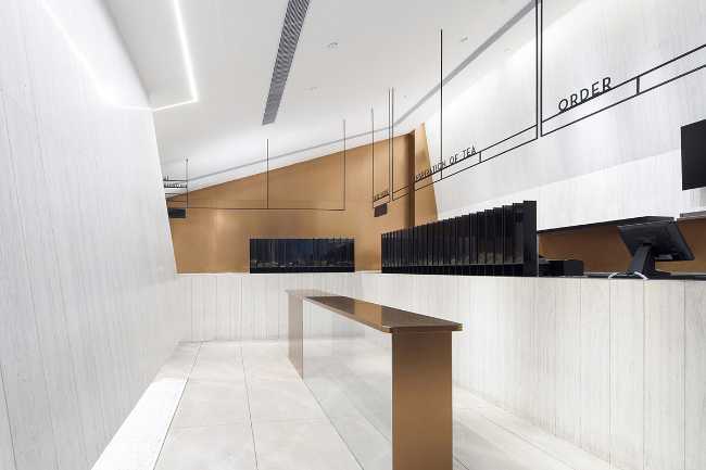 negozio Flagship Store Heytea rivestimenti in alluminio dorato ceramica